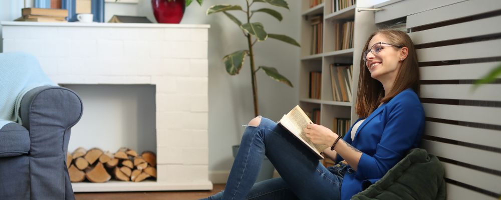 Woman sitting on floor in her living room